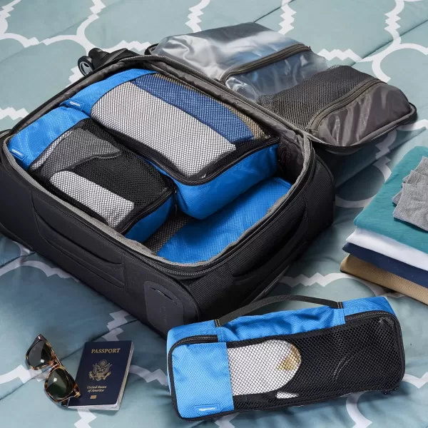imageAmazon Basics Lightweight Packing Cubes for Travel 4 Piece Set With Double Zipper Pulls and Mesh Top Panel 100 Durable Polyester Small Sky BlueBlue