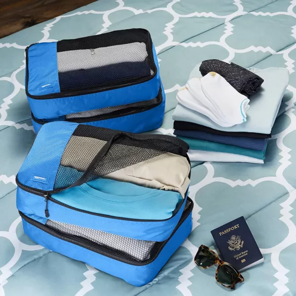 imageAmazon Basics Lightweight Packing Cubes for Travel 4 Piece Set With Double Zipper Pulls and Mesh Top Panel 100 Durable Polyester Small Sky BlueBlue