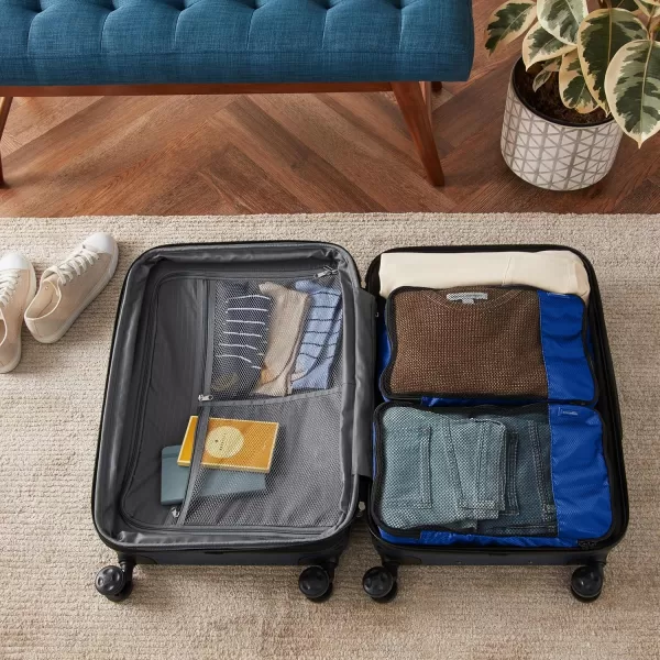 imageAmazon Basics Lightweight Packing Cubes for Travel 4 Piece Set With Double Zipper Pulls and Mesh Top Panel 100 Durable Polyester Small Sky BlueBlue