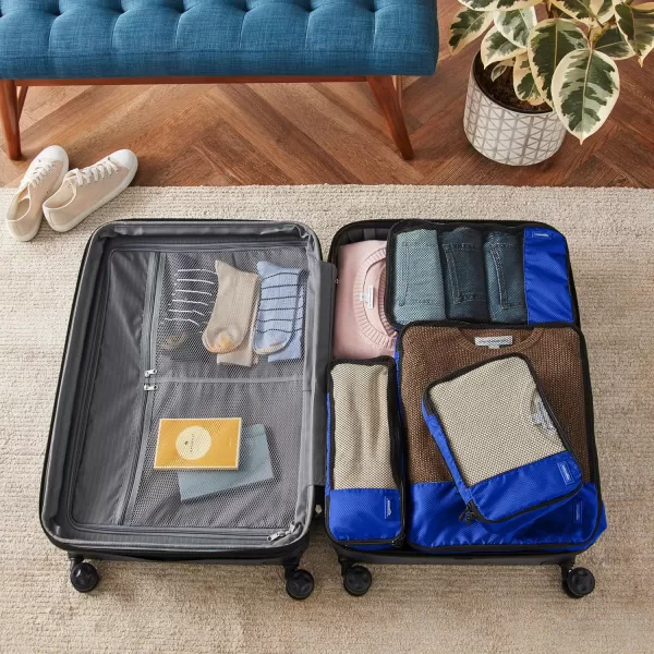 imageAmazon Basics Lightweight Packing Cubes for Travel 4 Piece Set With Double Zipper Pulls and Mesh Top Panel 100 Durable Polyester Small Sky BlueBlue