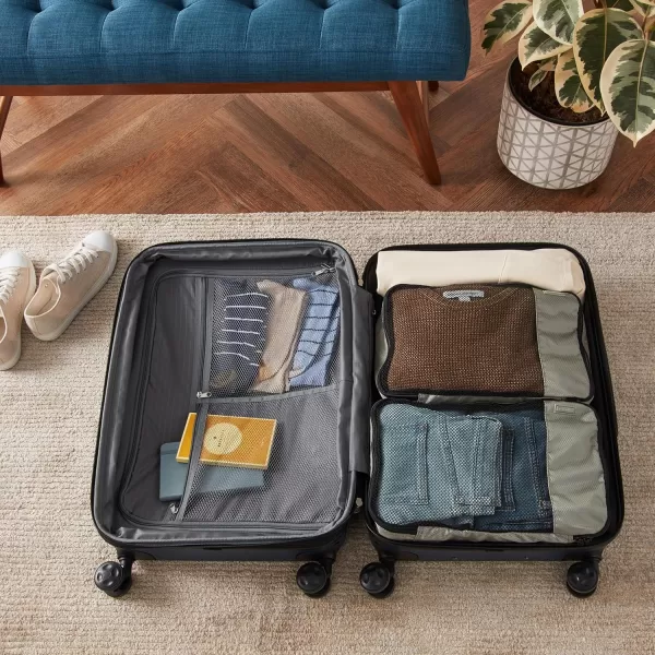 imageAmazon Basics Lightweight Packing Cubes for Travel 4 Piece Set With Double Zipper Pulls and Mesh Top Panel 100 Durable Polyester Small Sky BlueGray