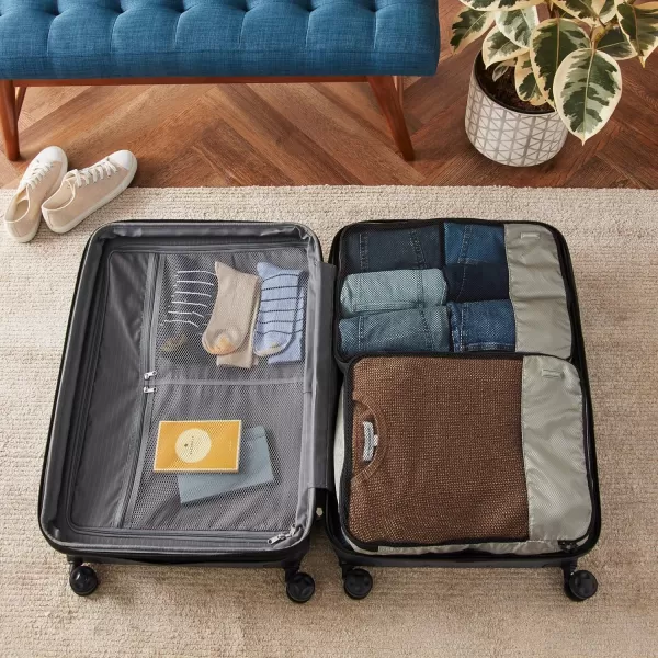 imageAmazon Basics Lightweight Packing Cubes for Travel 4 Piece Set With Double Zipper Pulls and Mesh Top Panel 100 Durable Polyester Small Sky BlueGray