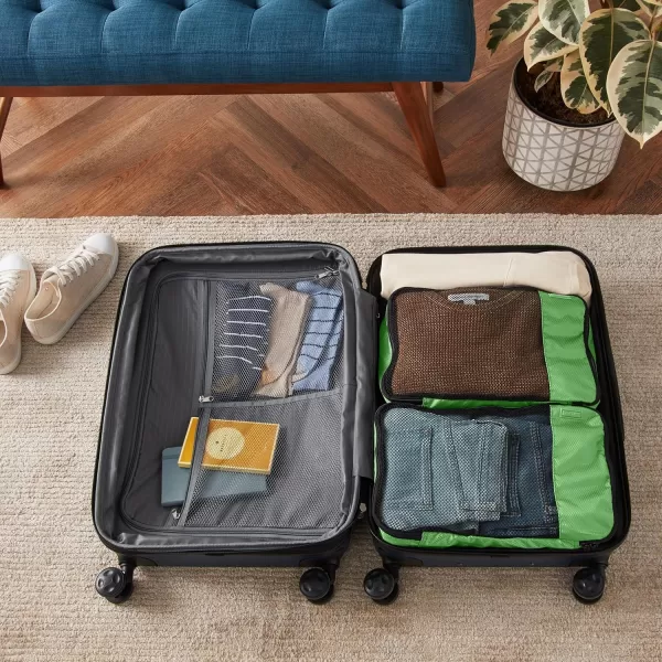 imageAmazon Basics Lightweight Packing Cubes for Travel 4 Piece Set With Double Zipper Pulls and Mesh Top Panel 100 Durable Polyester Small Sky BlueGreen