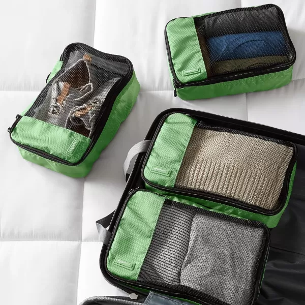imageAmazon Basics Lightweight Packing Cubes for Travel 4 Piece Set With Double Zipper Pulls and Mesh Top Panel 100 Durable Polyester Small Sky BlueGreen