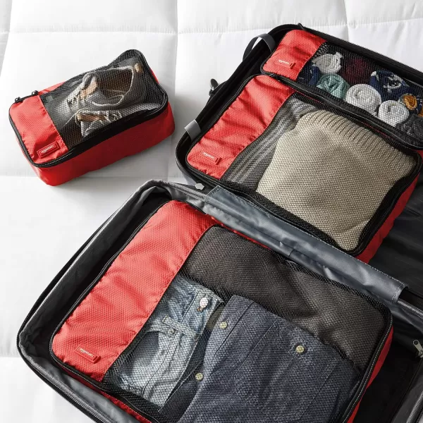 imageAmazon Basics Lightweight Packing Cubes for Travel 4 Piece Set With Double Zipper Pulls and Mesh Top Panel 100 Durable Polyester Small Sky BlueRed