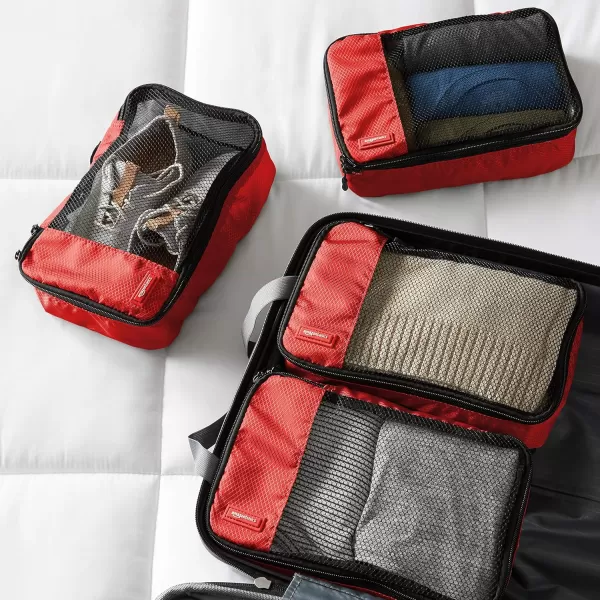 imageAmazon Basics Lightweight Packing Cubes for Travel 4 Piece Set With Double Zipper Pulls and Mesh Top Panel 100 Durable Polyester Small Sky BlueRed