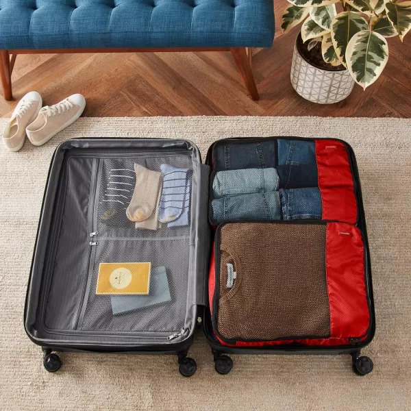 imageAmazon Basics Lightweight Packing Cubes for Travel 4 Piece Set With Double Zipper Pulls and Mesh Top Panel 100 Durable Polyester Small Sky BlueRed