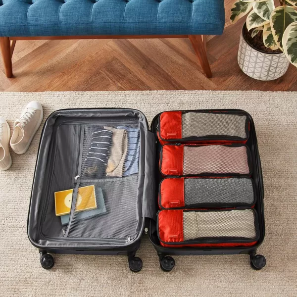 imageAmazon Basics Lightweight Packing Cubes for Travel 4 Piece Set With Double Zipper Pulls and Mesh Top Panel 100 Durable Polyester Small Sky BlueRed