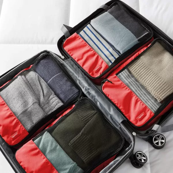imageAmazon Basics Lightweight Packing Cubes for Travel 4 Piece Set With Double Zipper Pulls and Mesh Top Panel 100 Durable Polyester Small Sky BlueRed