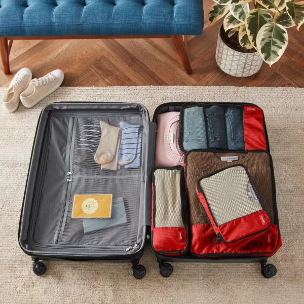 imageAmazon Basics Lightweight Packing Cubes for Travel 4 Piece Set With Double Zipper Pulls and Mesh Top Panel 100 Durable Polyester Small Sky BlueRed