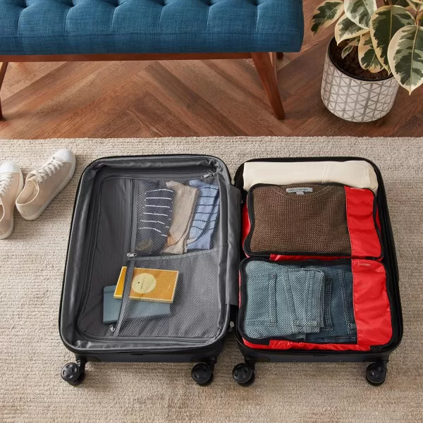 imageAmazon Basics Lightweight Packing Cubes for Travel 4 Piece Set With Double Zipper Pulls and Mesh Top Panel 100 Durable Polyester Small Sky BlueRed