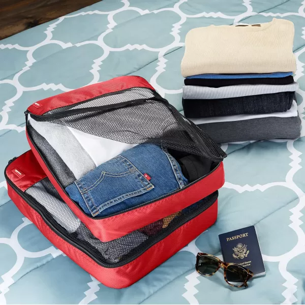 imageAmazon Basics Lightweight Packing Cubes for Travel 4 Piece Set With Double Zipper Pulls and Mesh Top Panel 100 Durable Polyester Small Sky BlueRed