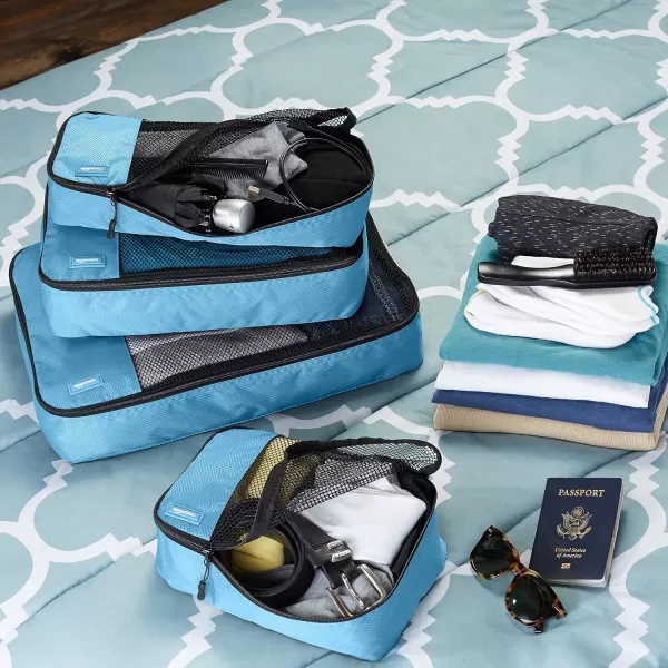 imageAmazon Basics Lightweight Packing Cubes for Travel 4 Piece Set With Double Zipper Pulls and Mesh Top Panel 100 Durable Polyester Small Sky BlueSky Blue