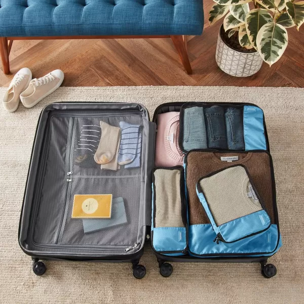 imageAmazon Basics Lightweight Packing Cubes for Travel 4 Piece Set With Double Zipper Pulls and Mesh Top Panel 100 Durable Polyester Small Sky BlueSky Blue