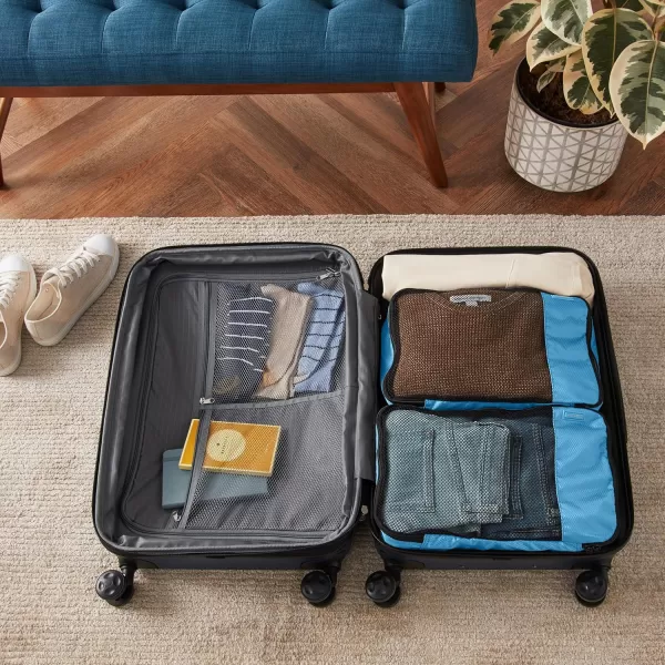 imageAmazon Basics Lightweight Packing Cubes for Travel 4 Piece Set With Double Zipper Pulls and Mesh Top Panel 100 Durable Polyester Small Sky BlueSky Blue