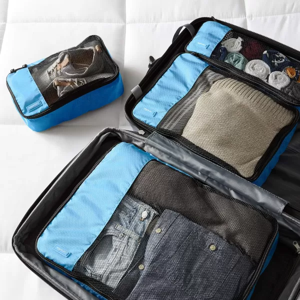 imageAmazon Basics Lightweight Packing Cubes for Travel 4 Piece Set With Double Zipper Pulls and Mesh Top Panel 100 Durable Polyester Small Sky BlueSky Blue