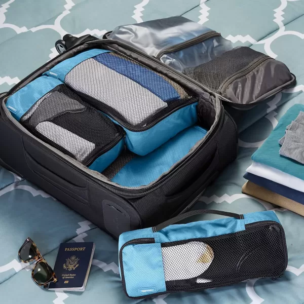 imageAmazon Basics Lightweight Packing Cubes for Travel 4 Piece Set With Double Zipper Pulls and Mesh Top Panel 100 Durable Polyester Small Sky BlueSky Blue