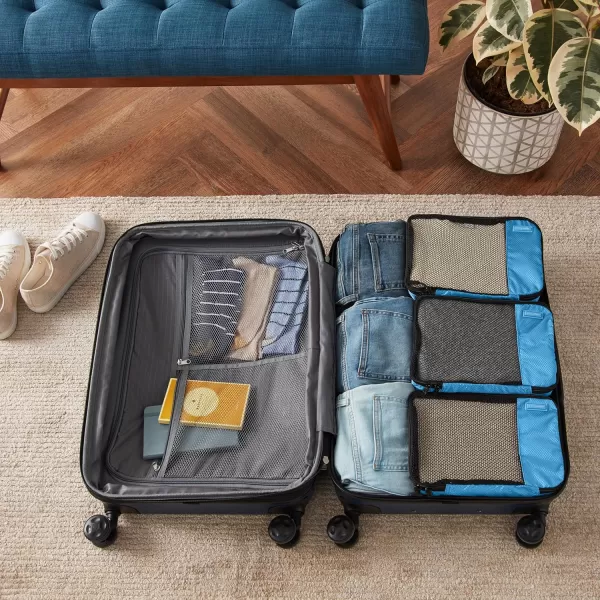 imageAmazon Basics Lightweight Packing Cubes for Travel 4 Piece Set With Double Zipper Pulls and Mesh Top Panel 100 Durable Polyester Small Sky BlueSky Blue