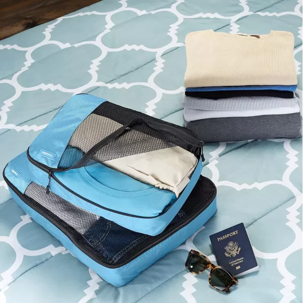 imageAmazon Basics Lightweight Packing Cubes for Travel 4 Piece Set With Double Zipper Pulls and Mesh Top Panel 100 Durable Polyester Small Sky BlueSky Blue