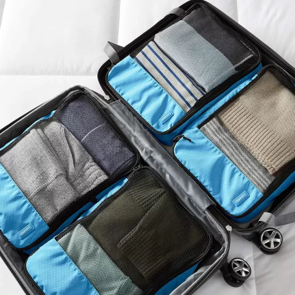 imageAmazon Basics Lightweight Packing Cubes for Travel 4 Piece Set With Double Zipper Pulls and Mesh Top Panel 100 Durable Polyester Small Sky BlueSky Blue