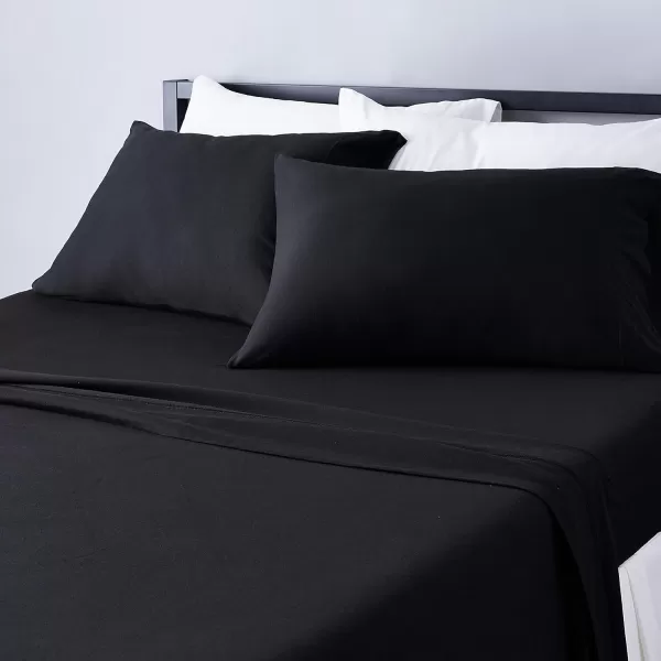 imageAmazon Basics 3 Piece Bed Sheets Set 100 Cotton Jersey Includes Super Soft Flat and Fitted Sheets Pillowcase 28 x 52 Inches Toddler White SolidBlack