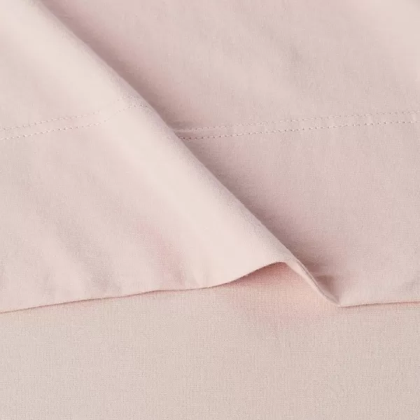 imageAmazon Basics 3 Piece Bed Sheets Set 100 Cotton Jersey Includes Super Soft Flat and Fitted Sheets Pillowcase 28 x 52 Inches Toddler White SolidBlush