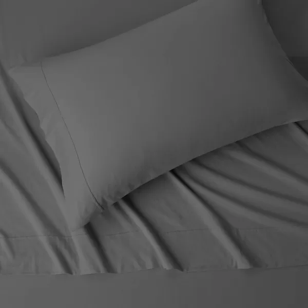 imageAmazon Basics 3 Piece Bed Sheets Set 100 Cotton Jersey Includes Super Soft Flat and Fitted Sheets Pillowcase 28 x 52 Inches Toddler White SolidDark Gray