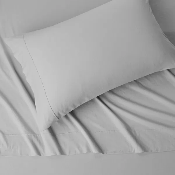 imageAmazon Basics 3 Piece Bed Sheets Set 100 Cotton Jersey Includes Super Soft Flat and Fitted Sheets Pillowcase 28 x 52 Inches Toddler White SolidLight Gray