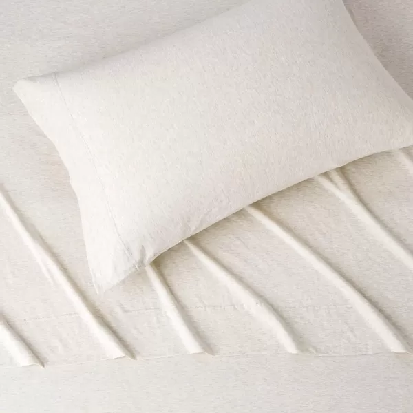 imageAmazon Basics 3 Piece Bed Sheets Set 100 Cotton Jersey Includes Super Soft Flat and Fitted Sheets Pillowcase 28 x 52 Inches Toddler White SolidOatmeal