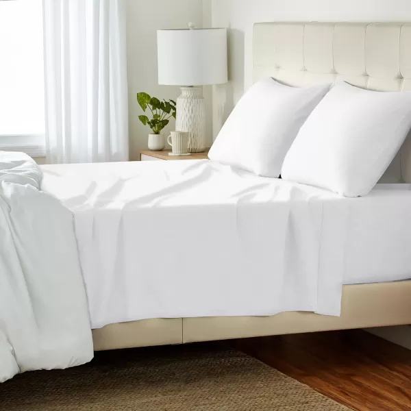 imageAmazon Basics 3 Piece Bed Sheets Set 100 Cotton Jersey Includes Super Soft Flat and Fitted Sheets Pillowcase 28 x 52 Inches Toddler White SolidWhite
