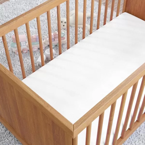 imageAmazon Basics 100 Cotton Jersey Knit Fitted Crib Sheet for Boys and Girls fits Standard Crib and Toddler Mattress Breathable Super Soft 28 x 52 Inches WhiteWhite