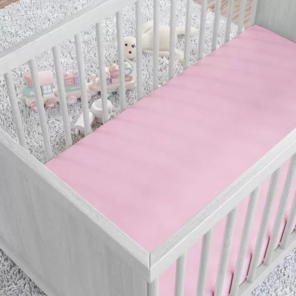 imageAmazon Basics 100 Cotton Jersey Knit Fitted Crib Sheet for Boys and Girls fits Standard Crib and Toddler Mattress Breathable Super Soft 28 x 52 Inches WhitePink