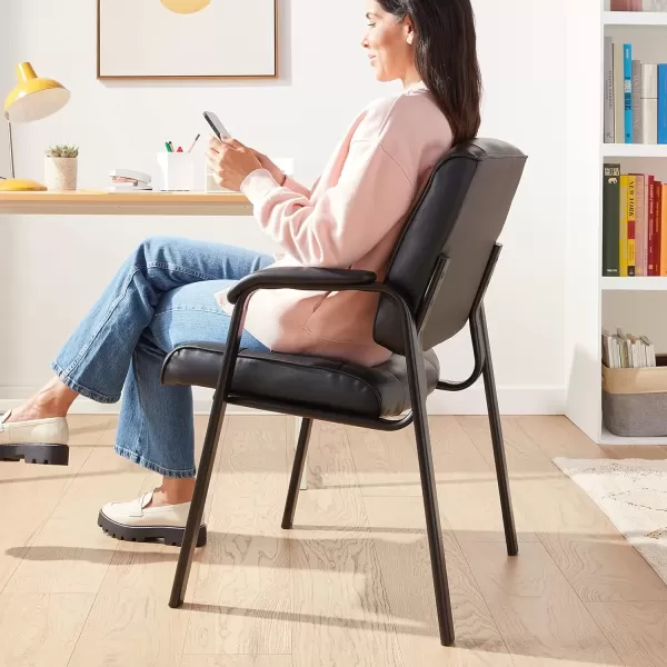 imageAmazon Basics Classic Faux Leather Office Desk Guest Chair with Metal Frame Black 274D x 236W x 358H in