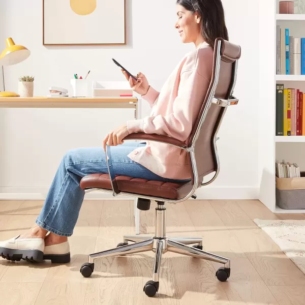 imageAmazon Basics HighBack Swivel Desk Chair Ergonomic Ribbed Faux Leather Upholstery Lumbar Support Home Modern Style Brick Red 2475quotD x 2325quotW x 4525quotHBrick Red