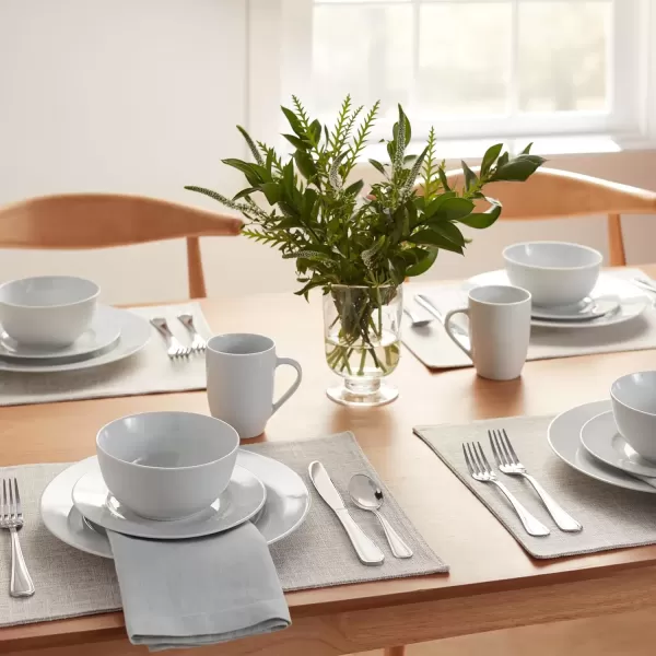 imageAmazon Basics 16Piece Porcelain Kitchen Dinnerware Set with Plates Bowls and Mugs Service for 4  WhiteWhite