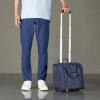 imageAmazon Basics Underseat Carry On Luggage with Wheels  14Inch Rolling Travel Bag BlackNavy Blue
