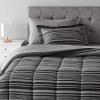 imageAmazon Basics Twin XL Comforter Set with Sheets 5Piece Blue Calvin Striped Bedding Lightweight Microfiber BedinaBagGray Calvin Stripe