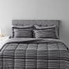 imageAmazon Basics Twin XL Comforter Set with Sheets 5Piece Blue Calvin Striped Bedding Lightweight Microfiber BedinaBagGray Calvin Stripe