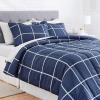 imageAmazon Basics Twin XL Comforter Set with Sheets 5Piece Blue Calvin Striped Bedding Lightweight Microfiber BedinaBagNavy With Grey Plaid