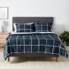 imageAmazon Basics Twin XL Comforter Set with Sheets 5Piece Blue Calvin Striped Bedding Lightweight Microfiber BedinaBagNavy With Grey Plaid