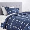 imageAmazon Basics Twin XL Comforter Set with Sheets 5Piece Blue Calvin Striped Bedding Lightweight Microfiber BedinaBagNavy With Grey Plaid
