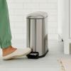 imageAmazon Basics Small Trash Can with Lid and SoftClose Foot Pedal for Bathroom Bedroom Living Room Office Smudge Resistant 20L  53 Gallon NickelBrushed Stainless Steel
