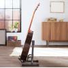 imageAmazon Basics Adjustable Guitar Folding AShape Frame Stand for Acoustic and Electric Guitars with NonSlip Rubber and Soft Foam Arms Fully Assembled Black