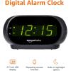imageAmazon Basics Small Digital Oval Alarm Clock With LED Display Nightlight ampamp Battery Backup Black 45 x 35 x 24 Inches