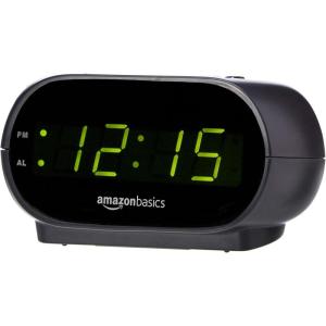 imageAmazon Basics Small Digital Oval Alarm Clock With LED Display Nightlight ampamp Battery Backup Black 45 x 35 x 24 Inches